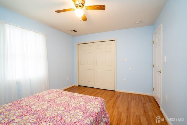 3 Clark Ct, Monroe, NJ 08831 - bedroom featuring a closet, light wood-style floors, visible vents, and baseboards
