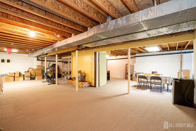 3 Clark Ct, Monroe, NJ 08831 - below grade area with carpet flooring and freestanding refrigerator
