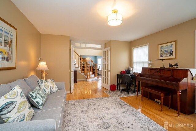 3 Clark Ct, Monroe, NJ 08831 - living area featuring french doors, wood finished floors, and stairway