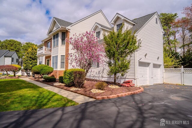 3 Clark Ct, Monroe, NJ 08831 - exterior space with brick siding, driveway, fence, and a garage