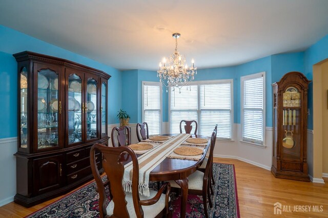 3 Clark Ct, Monroe, NJ 08831 - dining area with baseboards, an inviting chandelier, and light wood-style floors