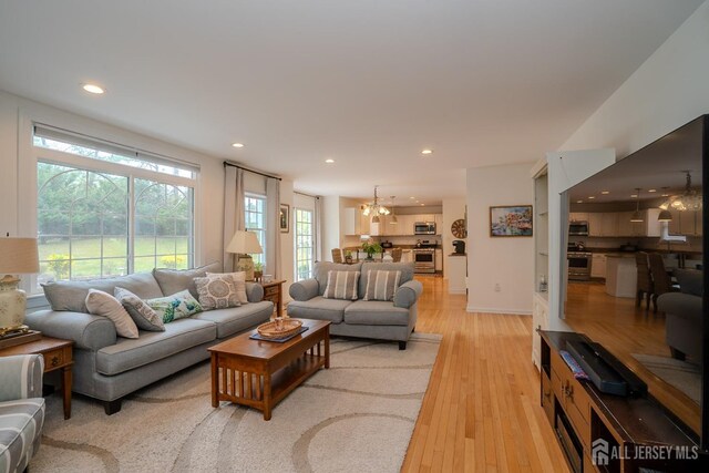 3 Clark Ct, Monroe, NJ 08831 - living area featuring recessed lighting, light wood-style floors, and an inviting chandelier