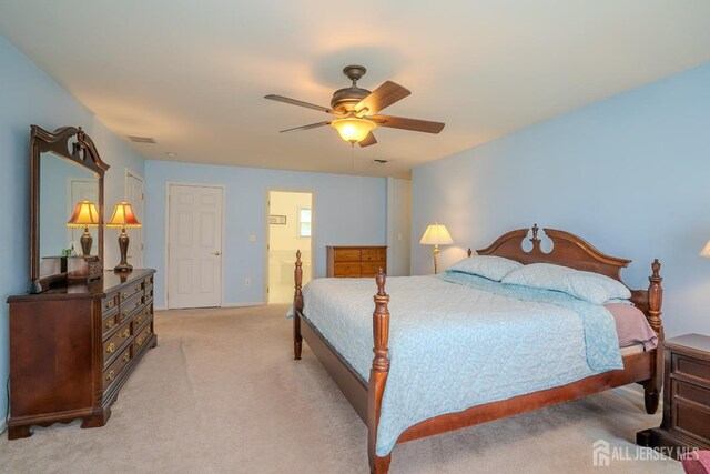 3 Clark Ct, Monroe, NJ 08831 - bedroom with visible vents, light colored carpet, ceiling fan, and ensuite bathroom