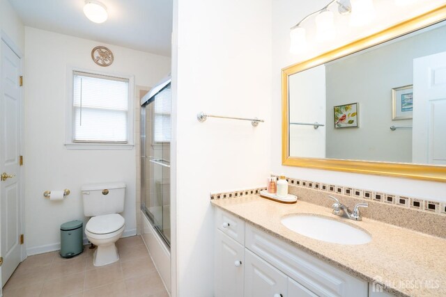 3 Clark Ct, Monroe, NJ 08831 - bathroom featuring tile patterned floors, vanity, bath / shower combo with glass door, baseboards, and toilet