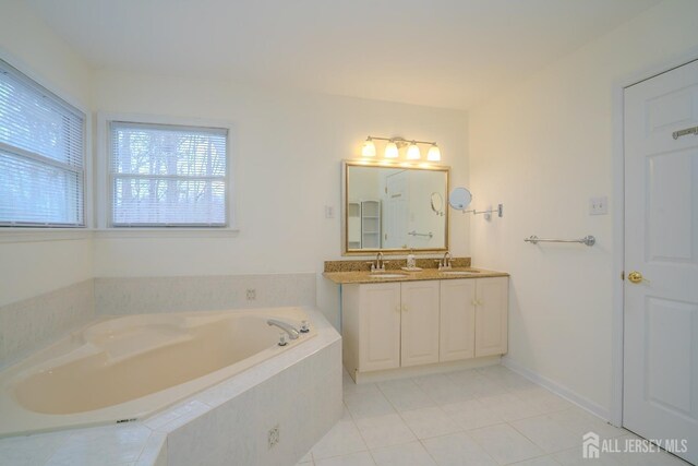 3 Clark Ct, Monroe, NJ 08831 - full bath featuring double vanity, a bath, tile patterned flooring, and a sink