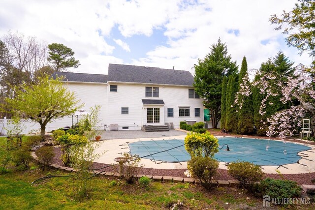 3 Clark Ct, Monroe, NJ 08831 - rear view of house featuring a covered pool, fence, entry steps, a patio area, and crawl space