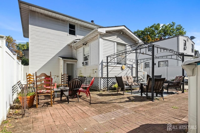 view of patio / terrace featuring a fenced backyard and an outdoor living space