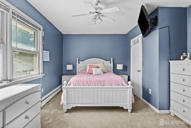 bedroom with light carpet, baseboards, a baseboard heating unit, and ceiling fan