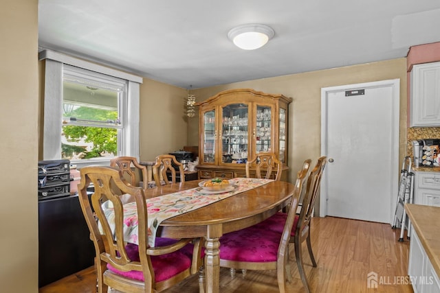 dining area featuring light wood finished floors