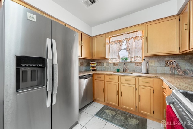 47 Florida St, Elizabeth, NJ 07206 - kitchen with stainless steel appliances, a sink, light countertops, and tasteful backsplash