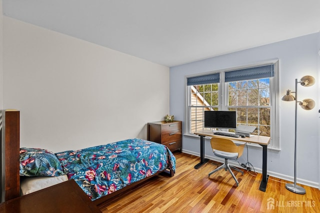 bedroom with light hardwood / wood-style flooring