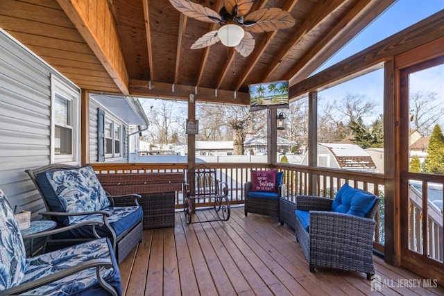 snow covered deck with an outdoor hangout area and ceiling fan