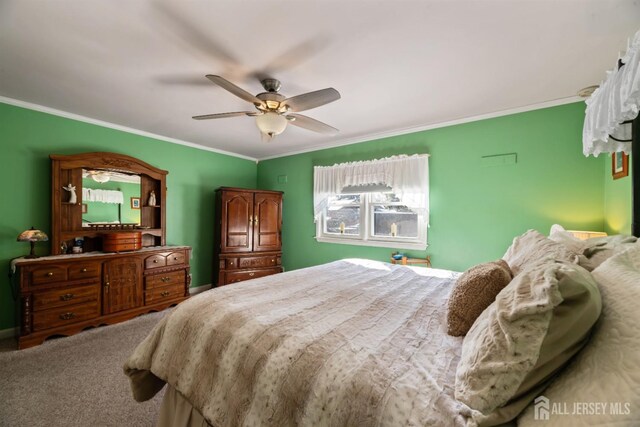 bedroom featuring ceiling fan and ornamental molding