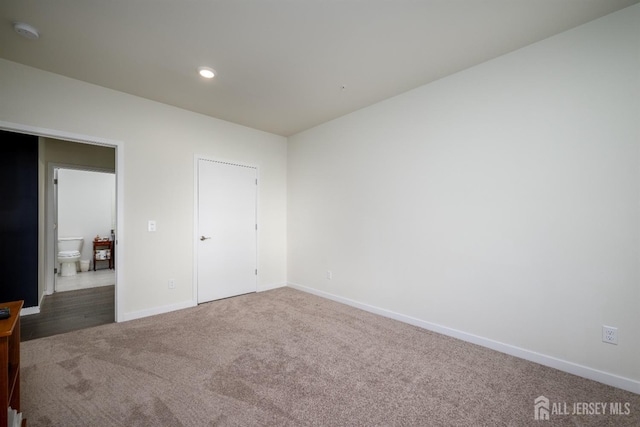 unfurnished bedroom with carpet