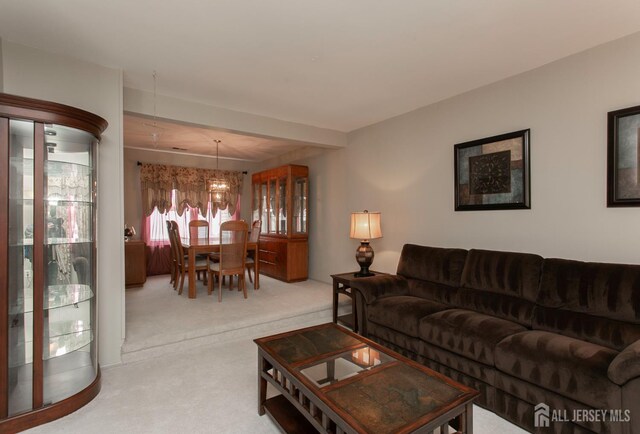 71 S Sagamore Ave, Edison, NJ 08820 - carpeted living area featuring a chandelier