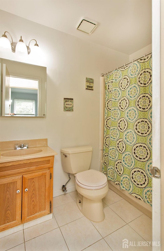 71 S Sagamore Ave, Edison, NJ 08820 - full bathroom featuring vanity, toilet, tile patterned flooring, and curtained shower