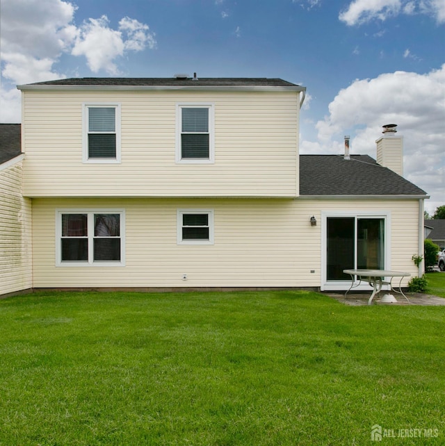 71 S Sagamore Ave, Edison, NJ 08820 - rear view of property with a yard and a chimney