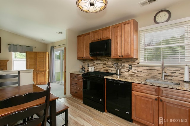 71 S Sagamore Ave, Edison, NJ 08820 - kitchen with black appliances, a sink, decorative backsplash, lofted ceiling, and light wood-style flooring