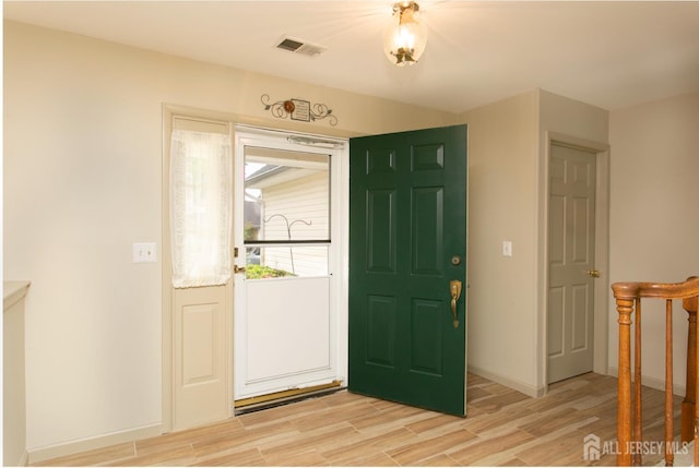 71 S Sagamore Ave, Edison, NJ 08820 - entrance foyer with light wood-style floors and baseboards