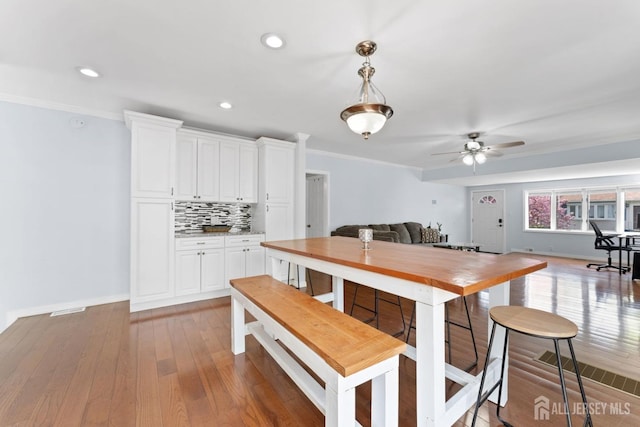 9 Hatakawana Ter, Mount Olive, NJ 07828 - dining room featuring ceiling fan, hardwood / wood-style flooring, baseboards, recessed lighting, and ornamental molding