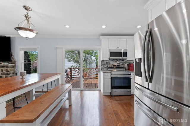 9 Hatakawana Ter, Mount Olive, NJ 07828 - kitchen with stainless steel appliances, white cabinetry, tasteful backsplash, wood-type flooring, and crown molding