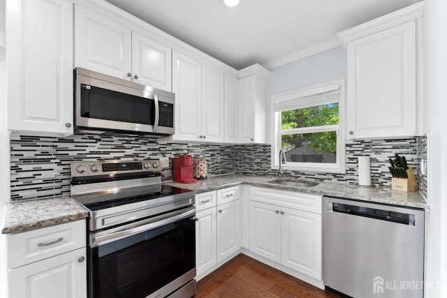 9 Hatakawana Ter, Mount Olive, NJ 07828 - kitchen with appliances with stainless steel finishes, a sink, backsplash, white cabinetry, and dark wood-style flooring