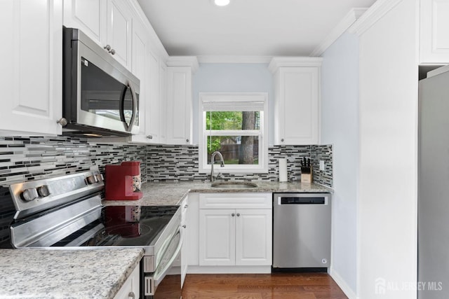 9 Hatakawana Ter, Mount Olive, NJ 07828 - kitchen featuring stainless steel appliances, a sink, white cabinetry, backsplash, and ornamental molding
