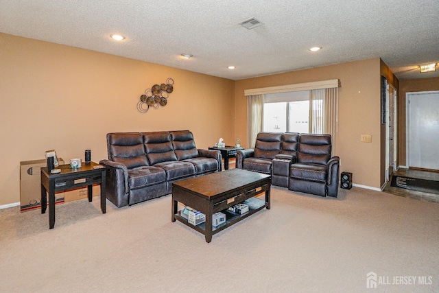 living area featuring carpet floors, recessed lighting, visible vents, a textured ceiling, and baseboards