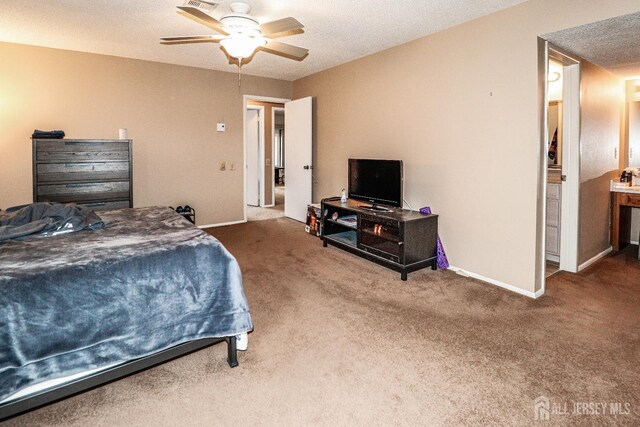 bedroom with a textured ceiling, carpet floors, ceiling fan, and baseboards