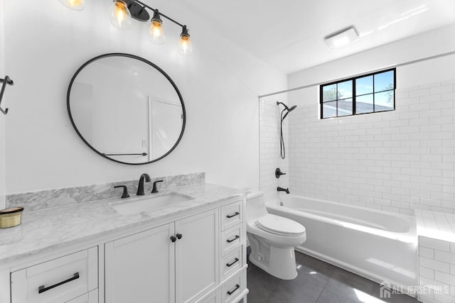 full bath with tile patterned floors, toilet, vanity, and shower / washtub combination