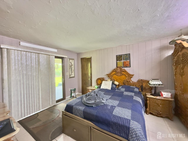 10 Van Buren Ave, Carteret, NJ 07008 - bedroom featuring access to outside, light tile patterned floors, and a textured ceiling