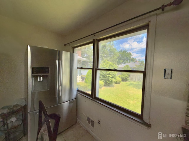 10 Van Buren Ave, Carteret, NJ 07008 - kitchen featuring stainless steel fridge, healthy amount of natural light, and light tile patterned floors
