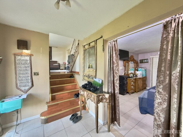 10 Van Buren Ave, Carteret, NJ 07008 - stairs with tile patterned floors, a textured ceiling, and a ceiling fan