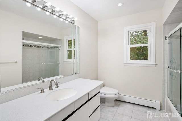 15 Meredith Rd, Edison, NJ 08817 - bathroom with a baseboard heating unit, plenty of natural light, vanity, tile patterned flooring, and recessed lighting