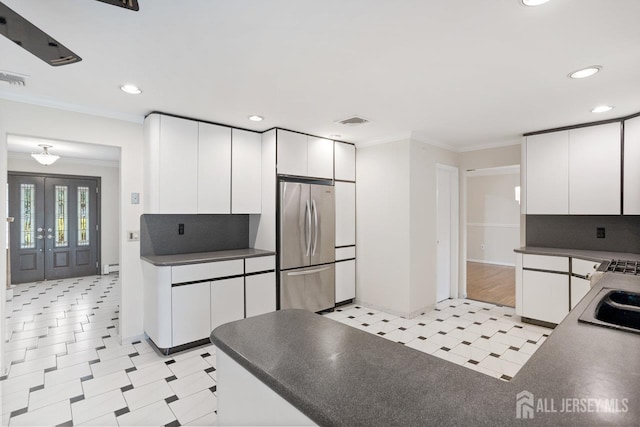 15 Meredith Rd, Edison, NJ 08817 - kitchen with freestanding refrigerator, light flooring, dark countertops, recessed lighting, and white cabinets