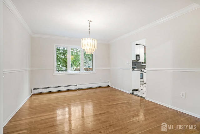 15 Meredith Rd, Edison, NJ 08817 - spare room featuring baseboard heating, a chandelier, light wood finished floors, ornamental molding, and baseboards