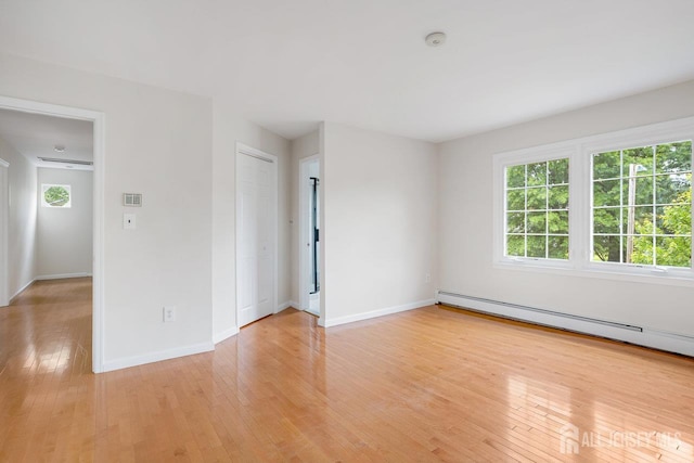 15 Meredith Rd, Edison, NJ 08817 - unfurnished room with light wood-type flooring, a baseboard heating unit, baseboards, and a smoke detector