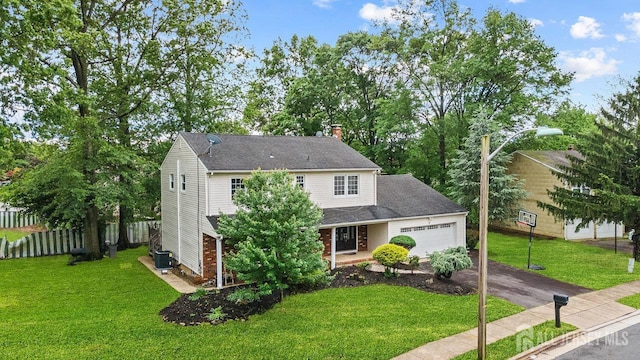 15 Meredith Rd, Edison, NJ 08817 - traditional-style house with driveway, an attached garage, central AC unit, and a chimney