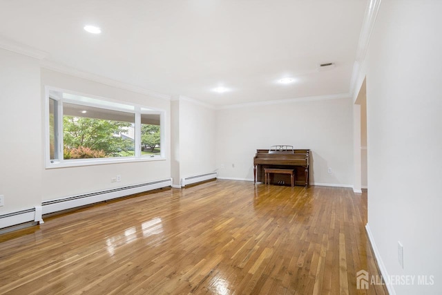15 Meredith Rd, Edison, NJ 08817 - unfurnished living room featuring crown molding, hardwood / wood-style floors, a baseboard heating unit, recessed lighting, and baseboards