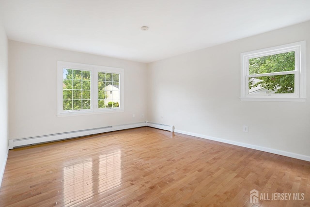 15 Meredith Rd, Edison, NJ 08817 - unfurnished room featuring light wood-type flooring, baseboard heating, and baseboards