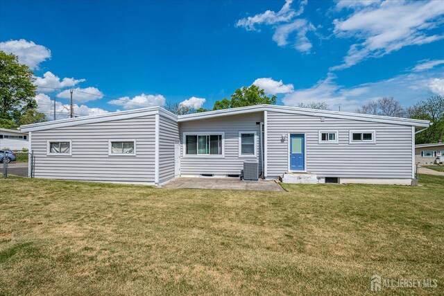 back of house featuring central air condition unit and a patio area
