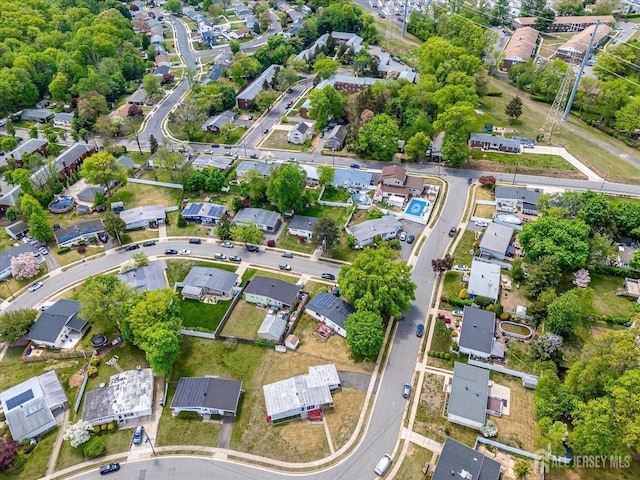 aerial overview of property's location with nearby suburban area