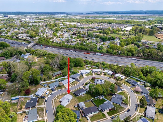view of property location with a highway and nearby suburban area