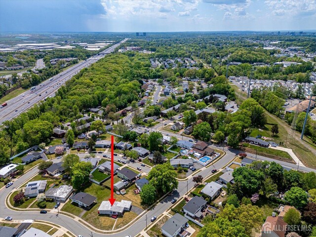 aerial perspective of suburban area with a major roadway