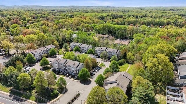 aerial perspective of suburban area with a heavily wooded area