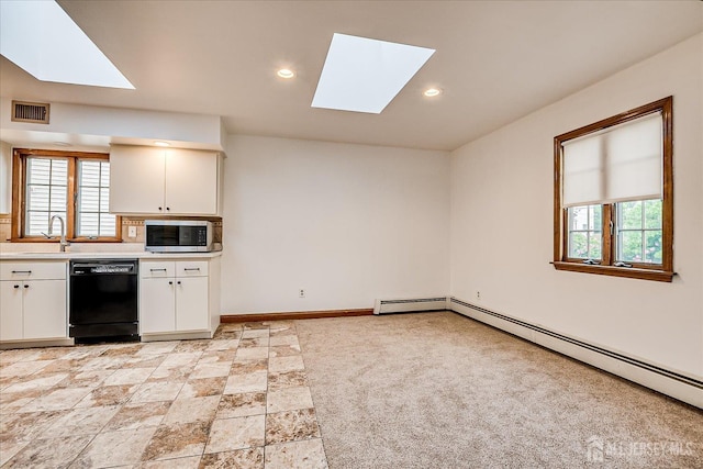 221 S Pine Ave S, South Amboy, NJ 08879 - kitchen with a skylight, dishwasher, stainless steel microwave, plenty of natural light, and recessed lighting