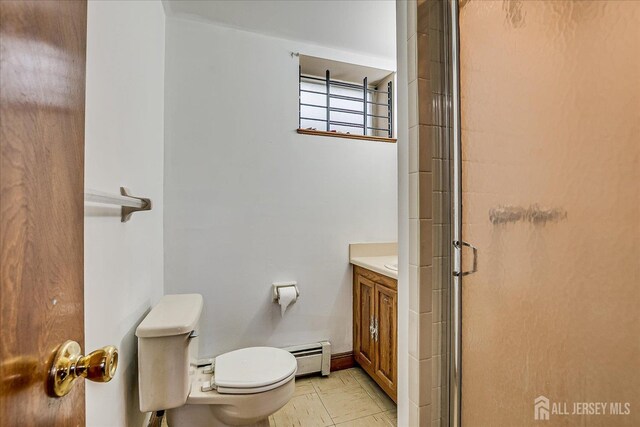 221 S Pine Ave S, South Amboy, NJ 08879 - bathroom with a baseboard radiator, vanity, and a shower stall