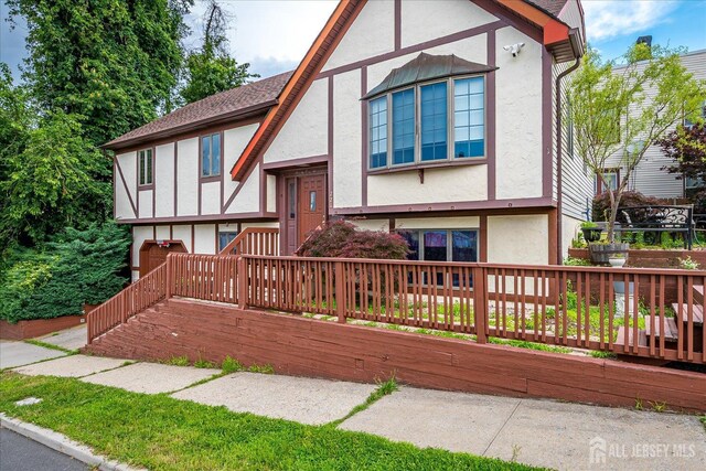 221 S Pine Ave S, South Amboy, NJ 08879 - tudor house with stucco siding and a deck