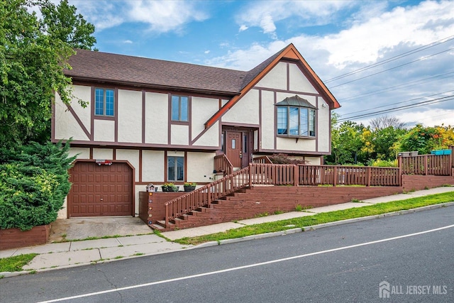 221 S Pine Ave S, South Amboy, NJ 08879 - view of front of property with a garage, stucco siding, and a shingled roof