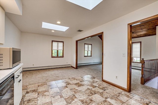 221 S Pine Ave S, South Amboy, NJ 08879 - unfurnished living room with a skylight, a baseboard radiator, light carpet, baseboard heating, and recessed lighting